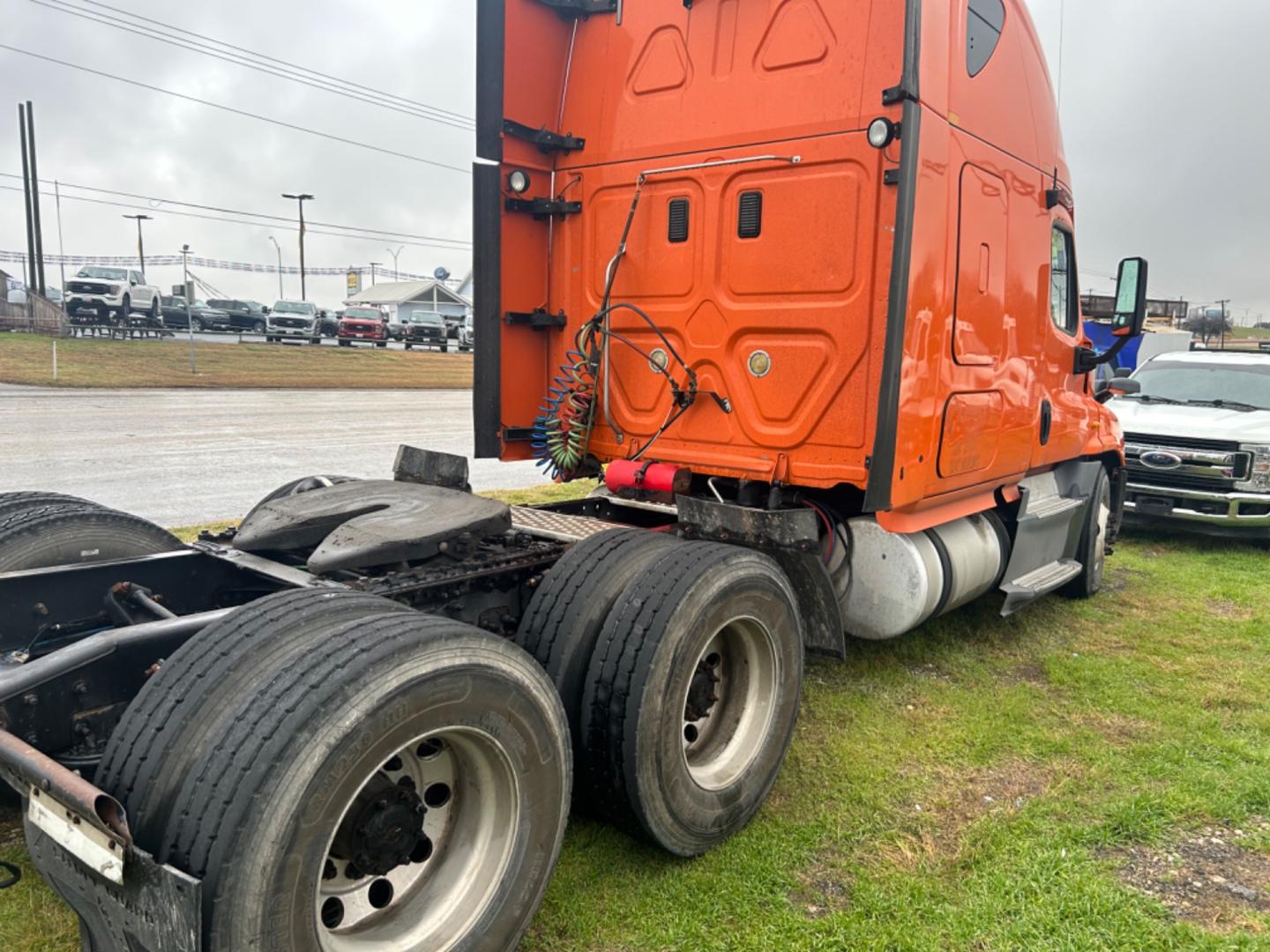 2013 Orange Freightliner Cascadia 125 (3AKJGLDR0DS) , located at 1687 Business 35 S, New Braunfels, TX, 78130, (830) 625-7159, 29.655487, -98.051491 - Photo#4
